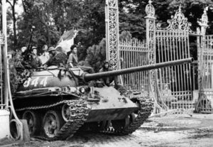 ADVANCE FOR -- -- USE SATURDAY, APRIL 25, 2015, AND THEREAFTER- FILE - In this April 30, 1975 file photo, a North Vietnamese tank rolls through the gates of the Presidential Palace in Saigon, signifying the fall of South Vietnam. The war ended on April 30, 1975, with the fall of Saigon, now known as Ho Chi Minh City, to communist troops from the north. (AP Photo/File)